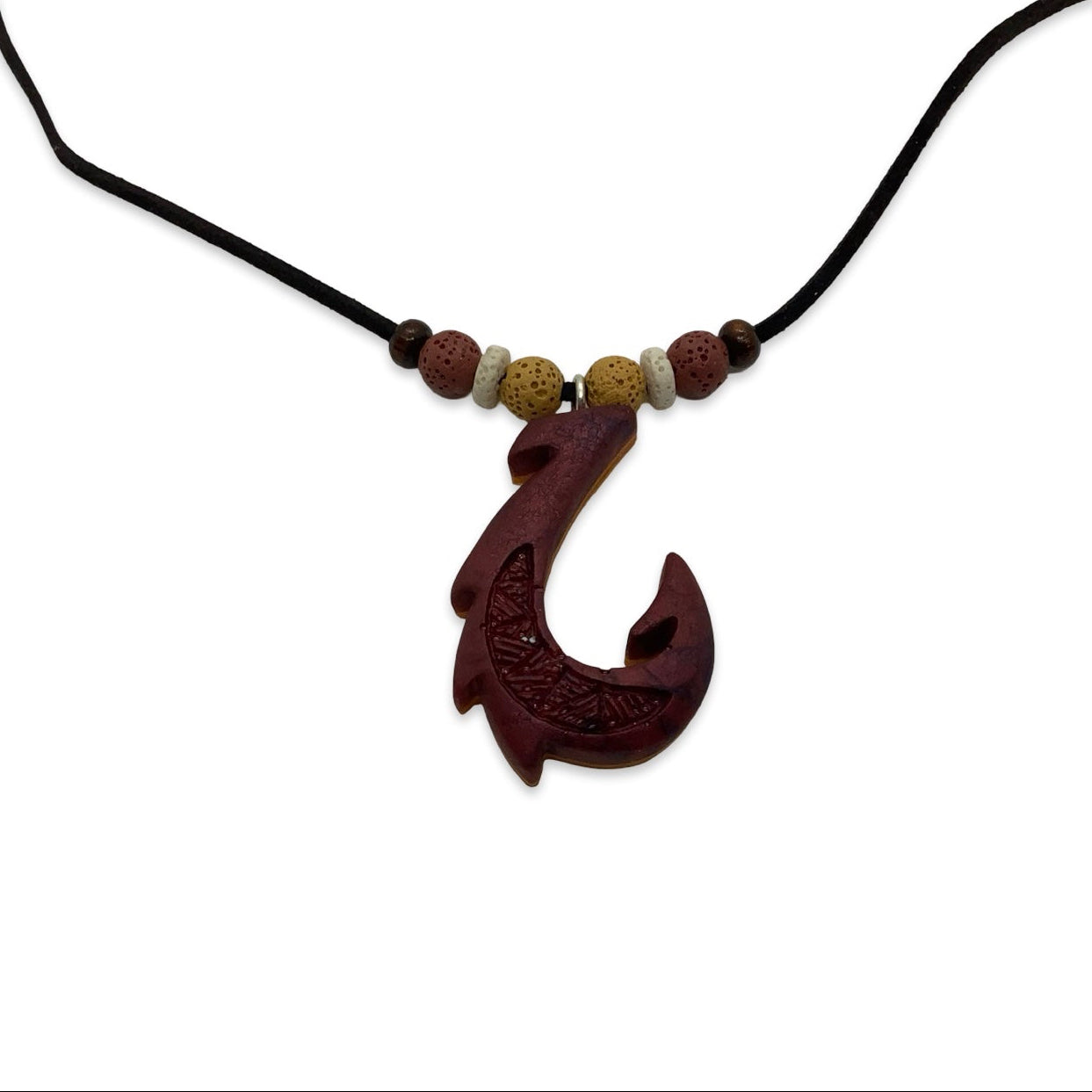 Bronze fish hook pendant on a black cord with beads against a white background