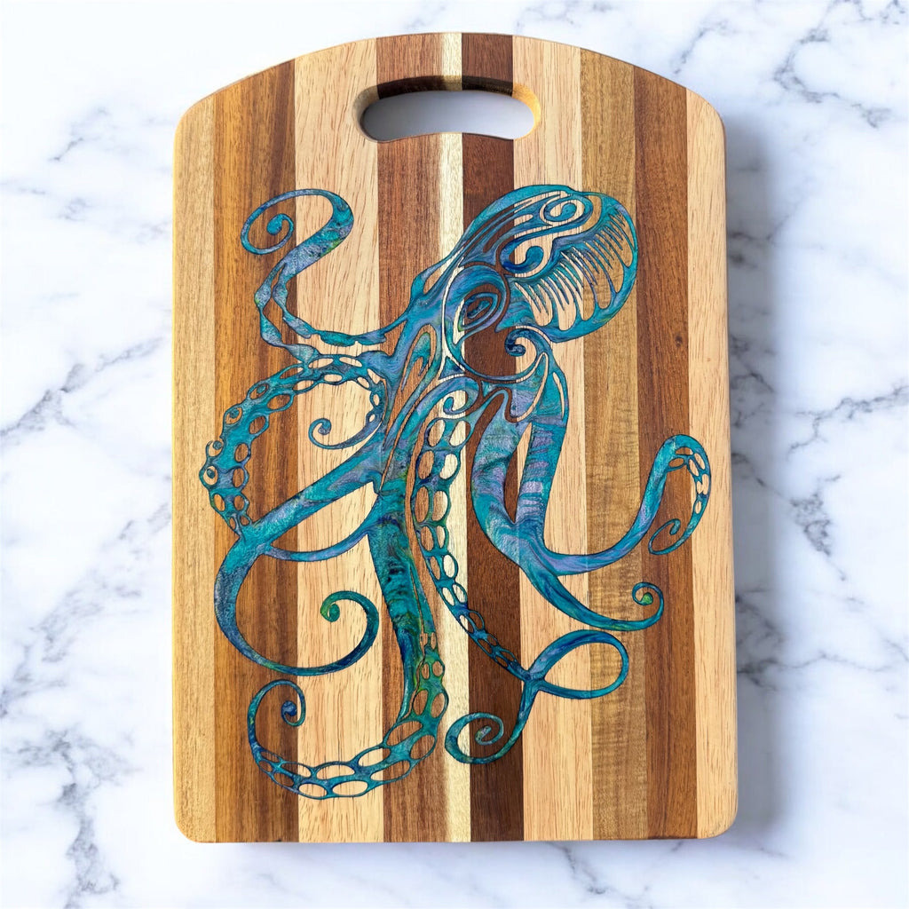 Wooden cutting board with a blue octopus design on a marble surface