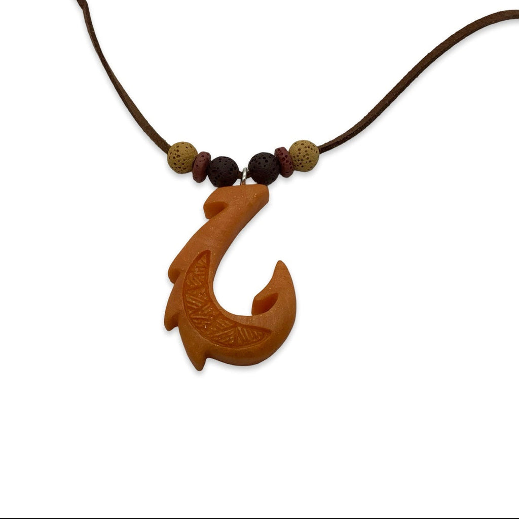 Orange fish hook pendant on a cord with beads against a white background