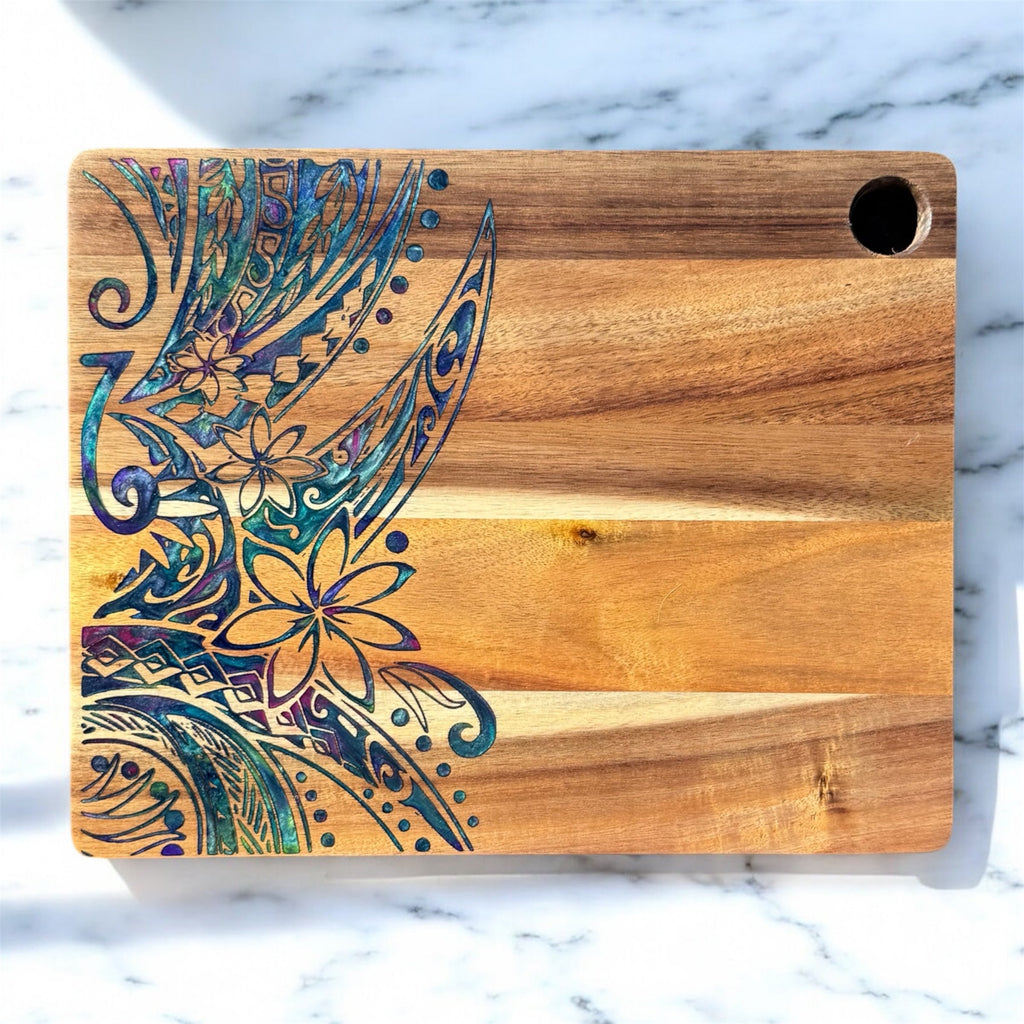 Wooden cutting board with a colorful abstract design on a marble surface