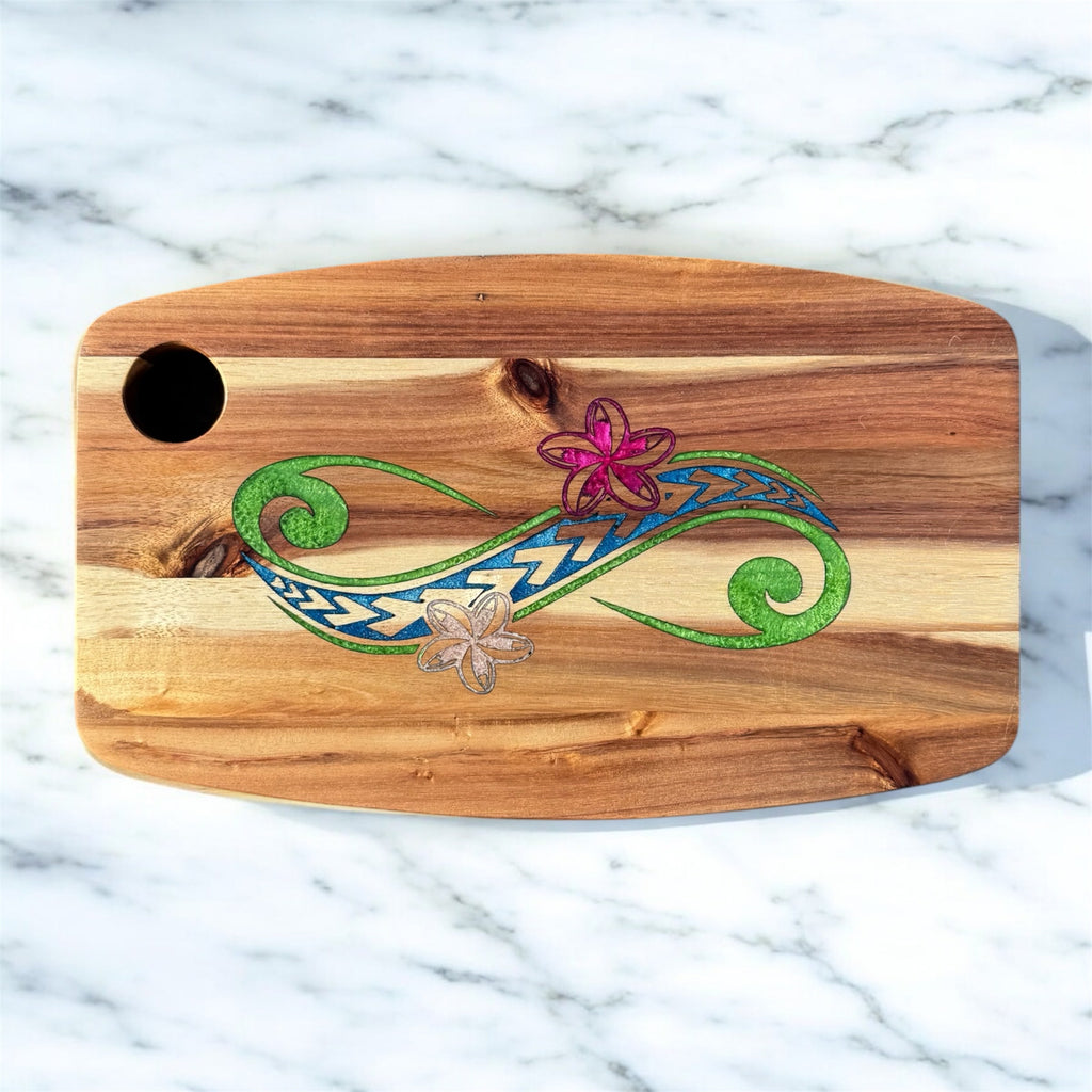 Wooden cutting board with decorative designs on a marble surface