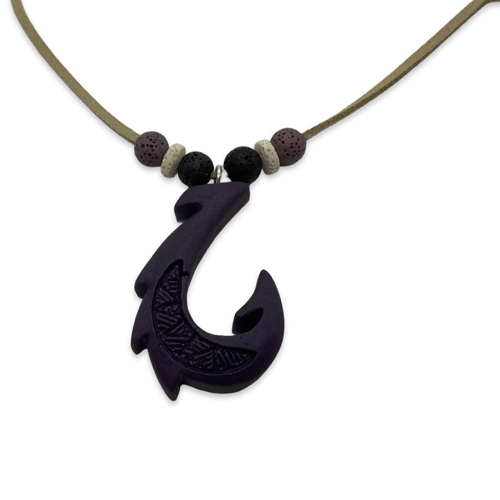 Necklace with a black fish hook pendant on a white background