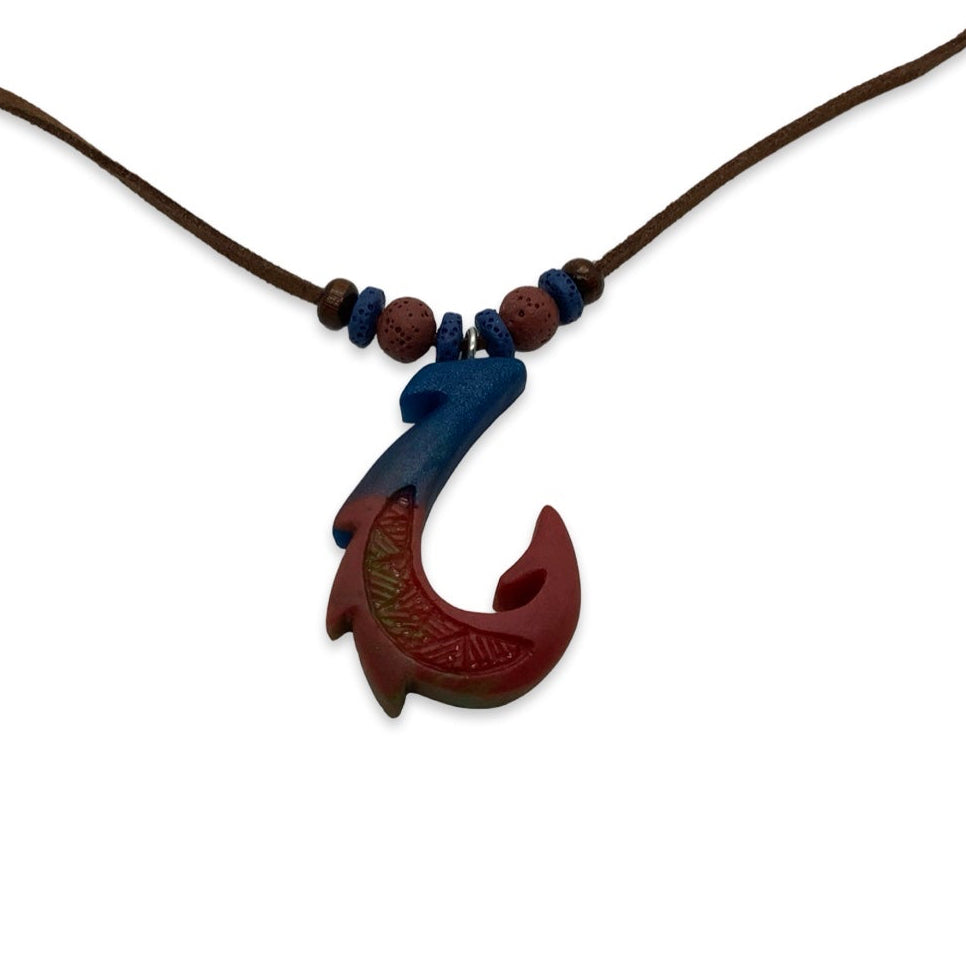 Wooden fish hook pendant on a brown cord with blue beads against a white background