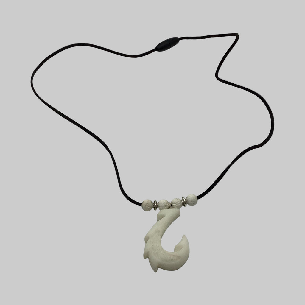 Necklace with a fish hook pendant on a white background